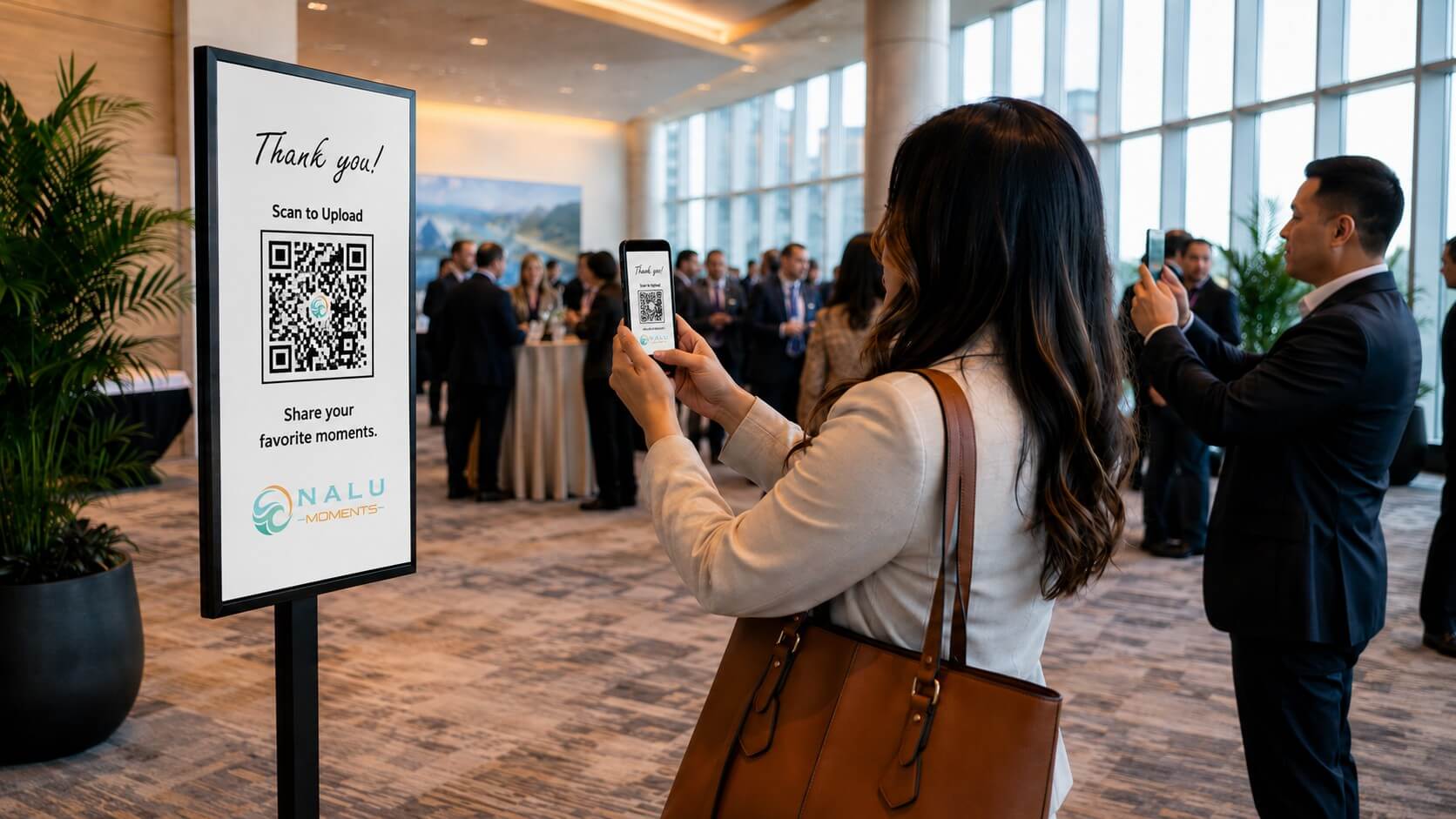Conference attendees using a QR code to upload event photos from a networking session